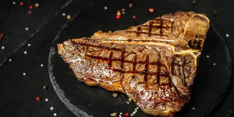 Broiled beef porterhouse steak