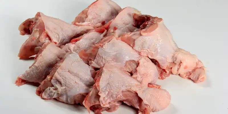 Raw chicken back (meat and skin)