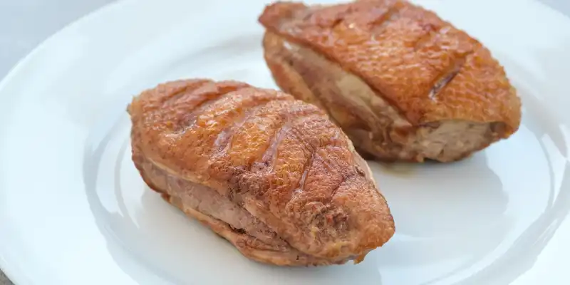 Fried chicken breast (meat and skin)