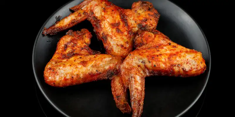 Fried chicken wing (meat and skin)