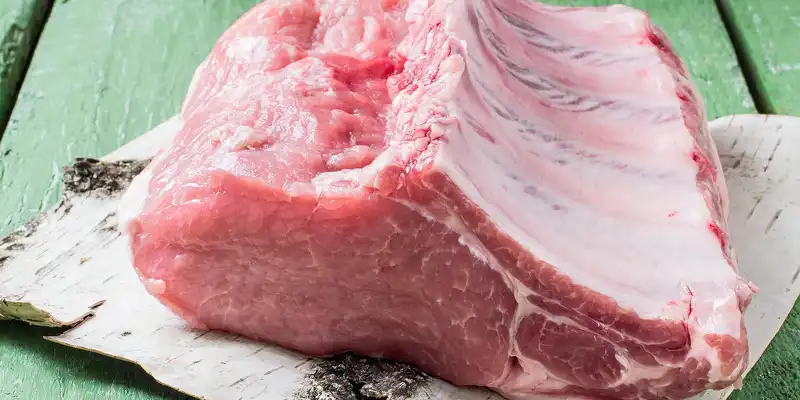 Raw pork center rib (bone in, chops or roasts)