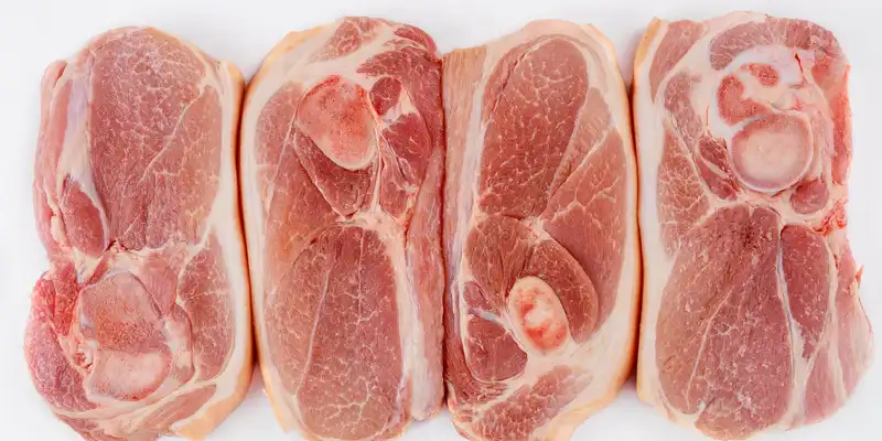 Raw pork blade (bone in, chops or roasts)